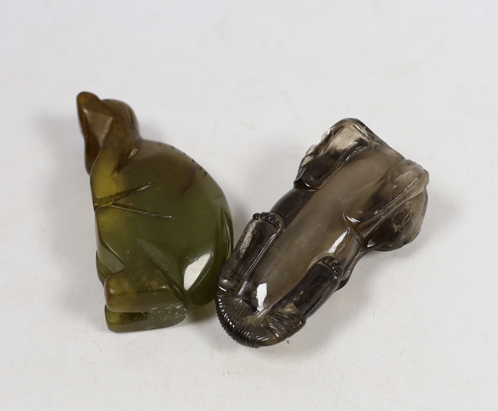 A Chinese smokey quartz lion scent bottle and a carved bowenite model of a monkey, longest 7.5cm